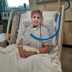 Kathy McDaniel ready to simulate a trached patient